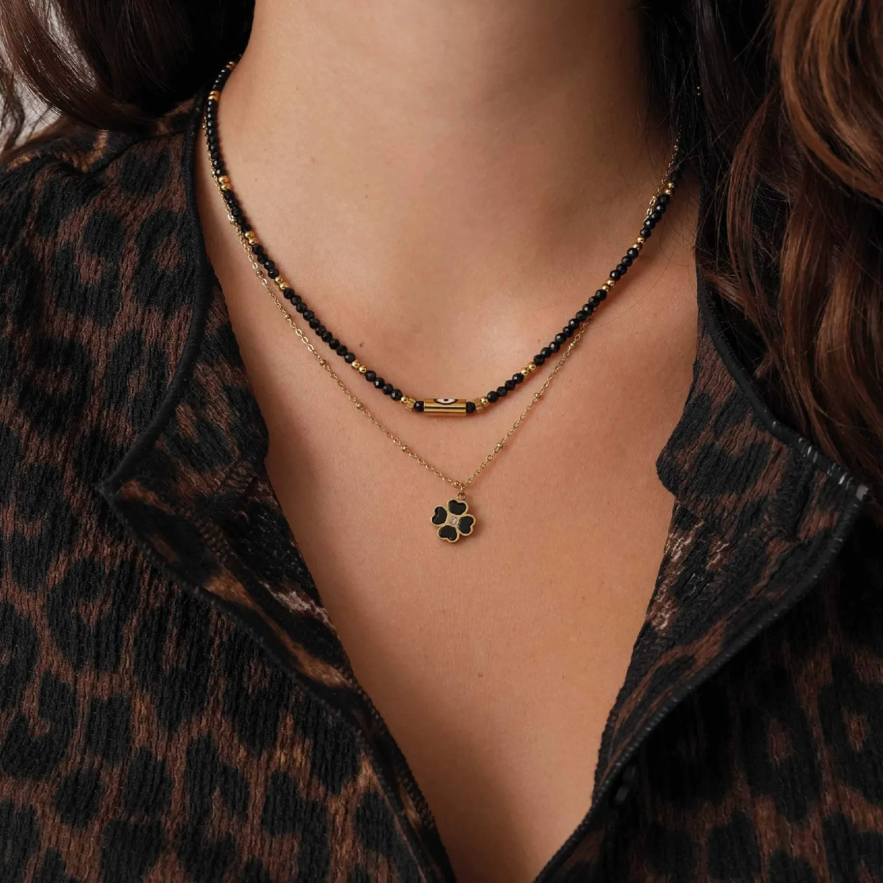 Collier Trefle noir acier doré or